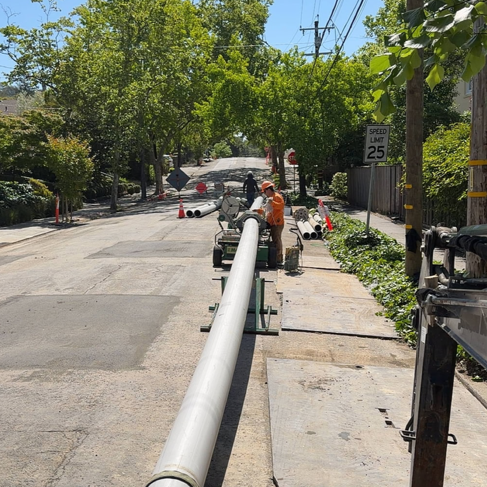 Bayside Trenchless crew installing a new sewer main using trenchless construction methods in a residential neighborhood.